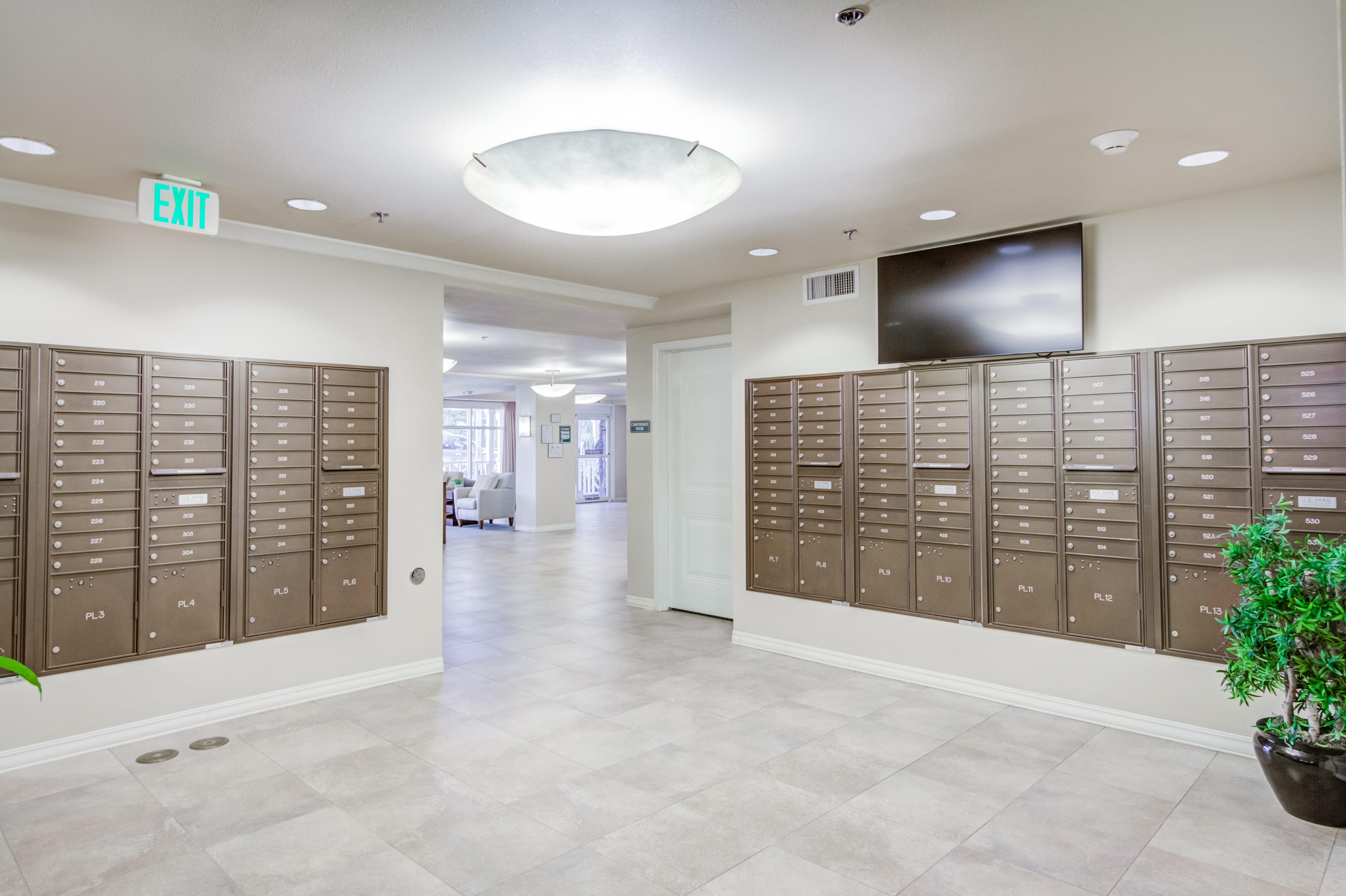 Organized resident mailbox area in a hallway at The Plaza Assisted Living.