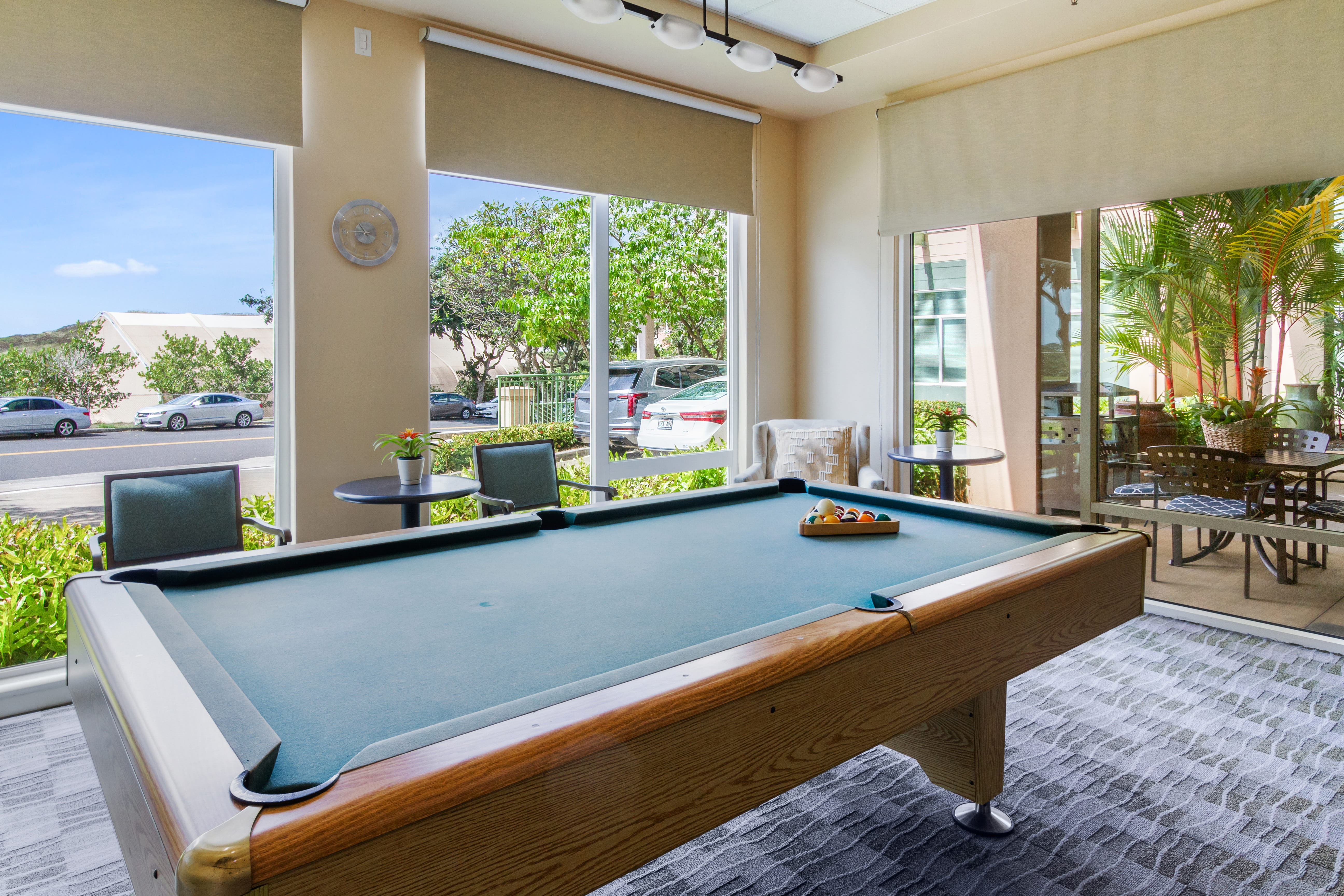 Pool table in a bright recreation room at The Plaza Assisted Living Moanalua.