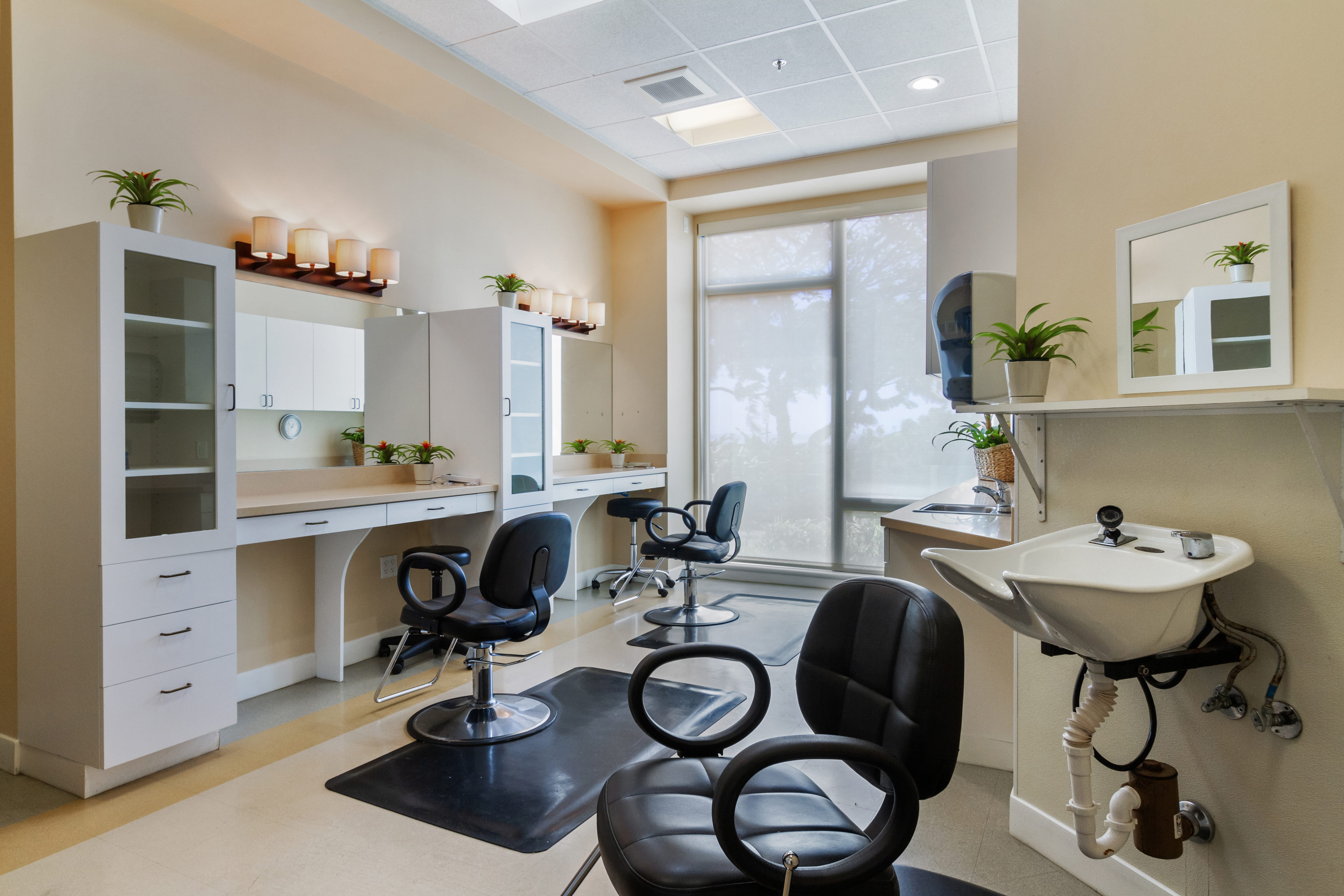 Modern on-site hair salon and barber shop at The Plaza Assisted Living Moanalua.