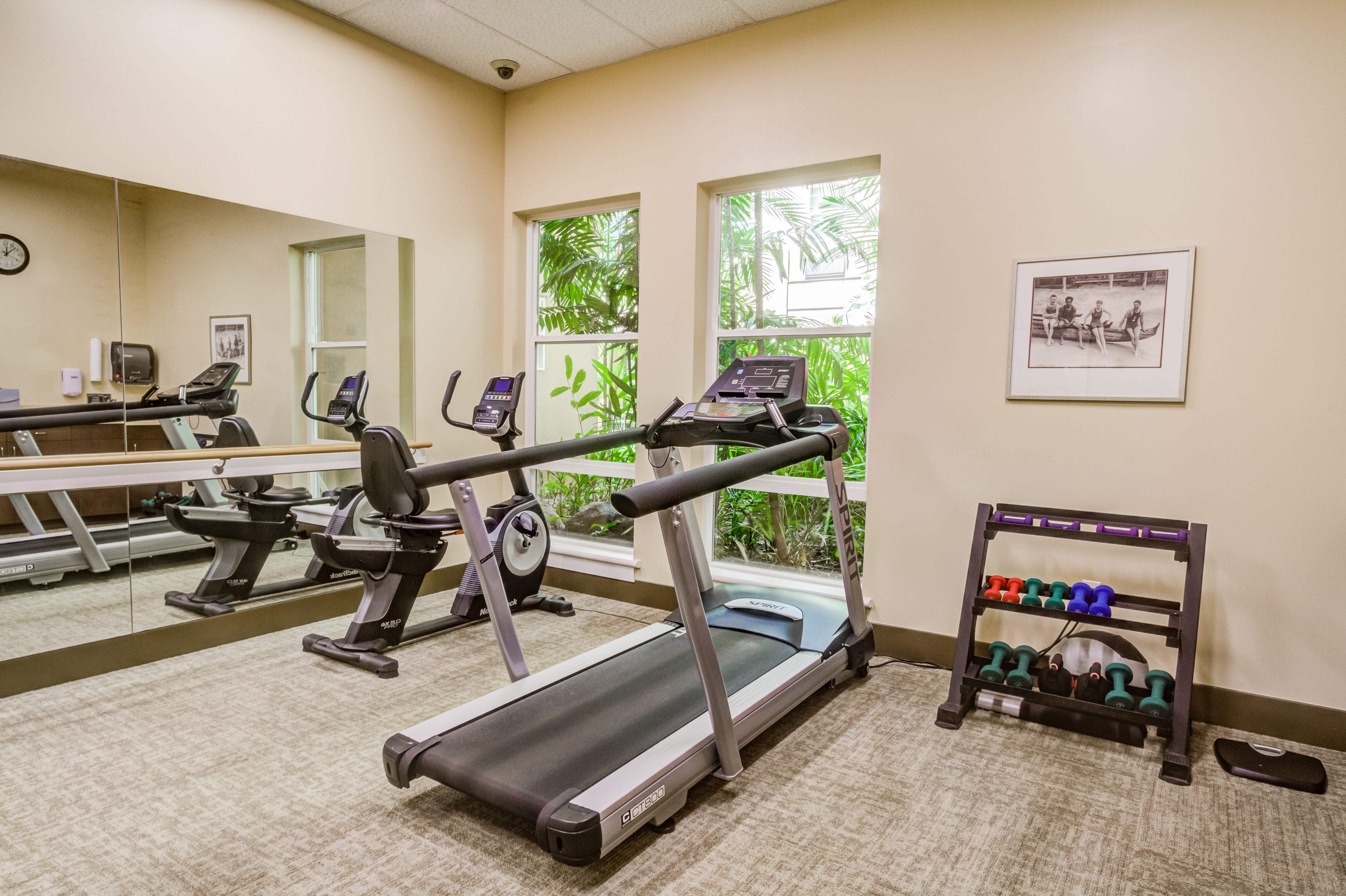 Resident fitness center with treadmill and exercise bike at The Plaza Assisted Living.