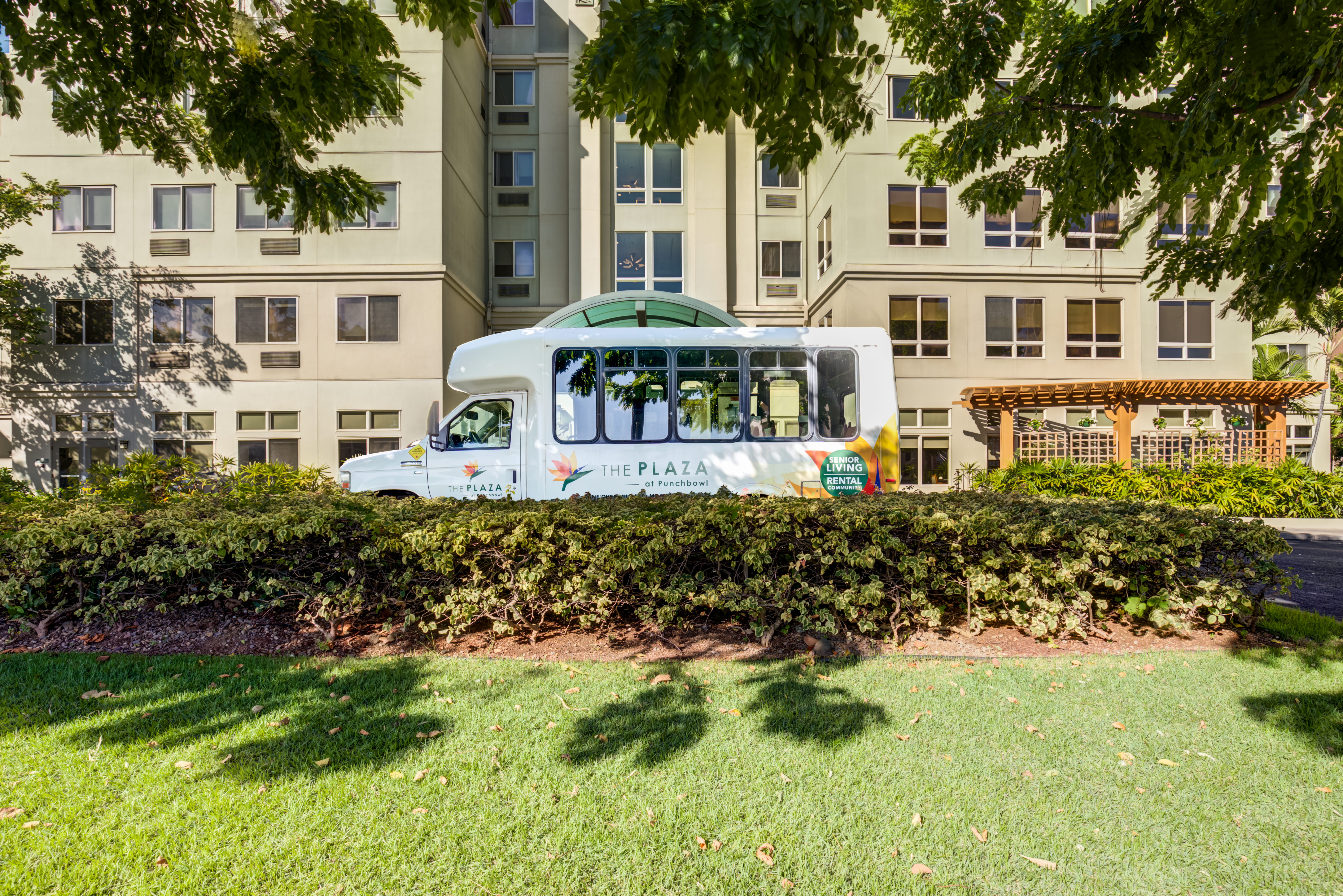 Plaza Assisted Living shuttle bus parked outside the Punchbowl facility.