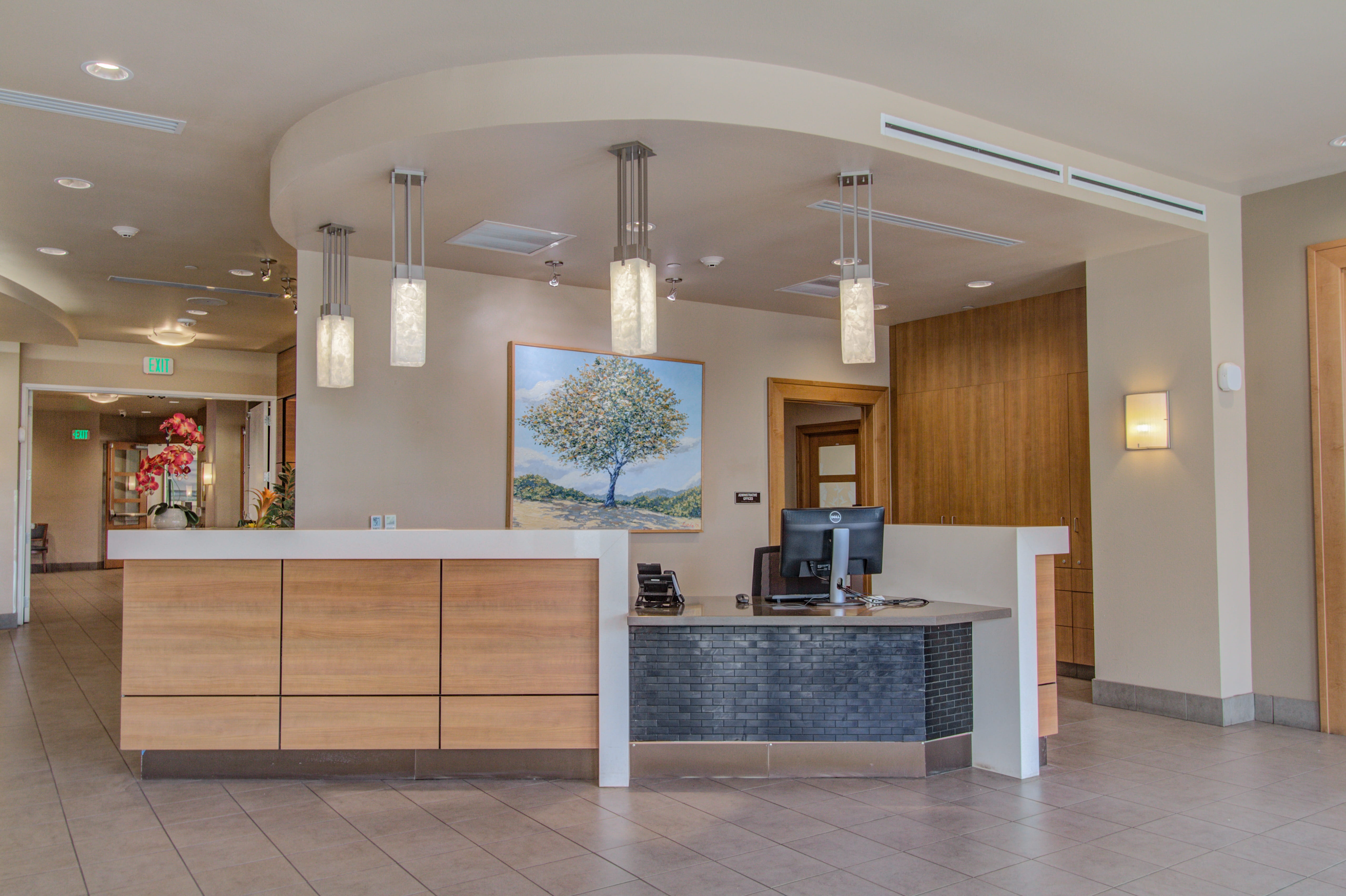 Modern reception desk at The Plaza Assisted Living Waikiki location.