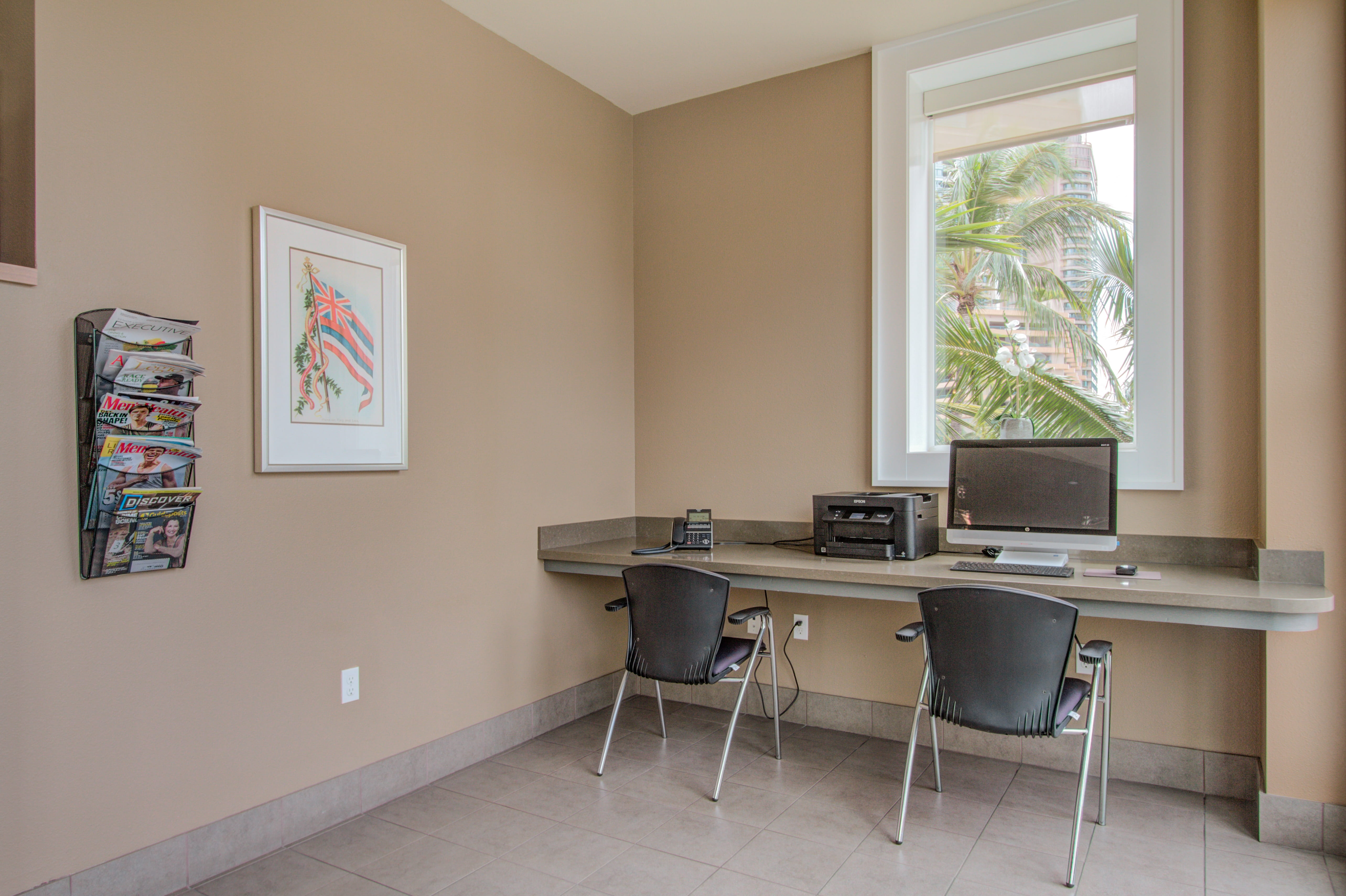 Resident computer workstation with a tropical window view.