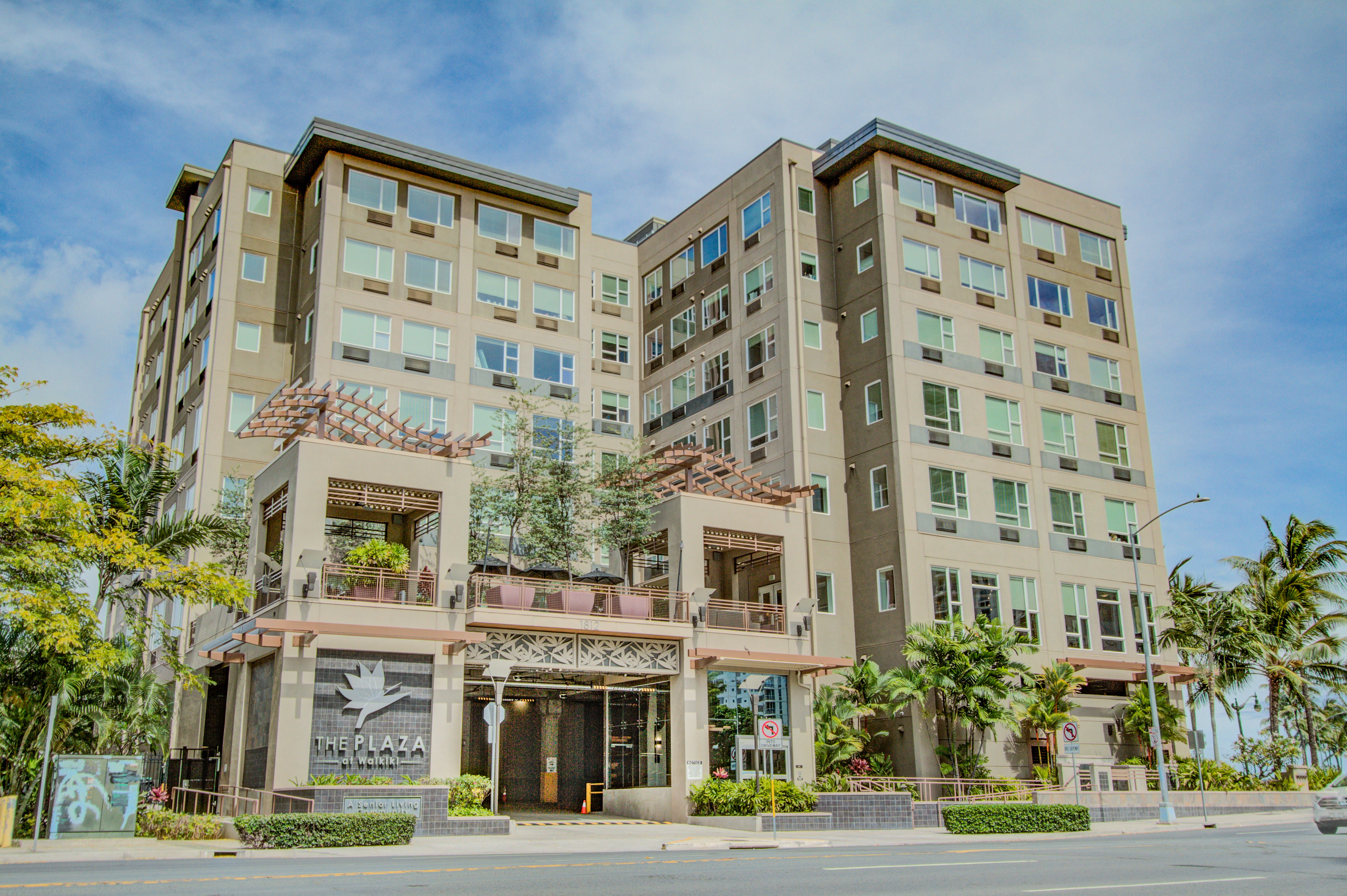 Exterior of The Plaza at Waikiki, a multi-story local senior living community.