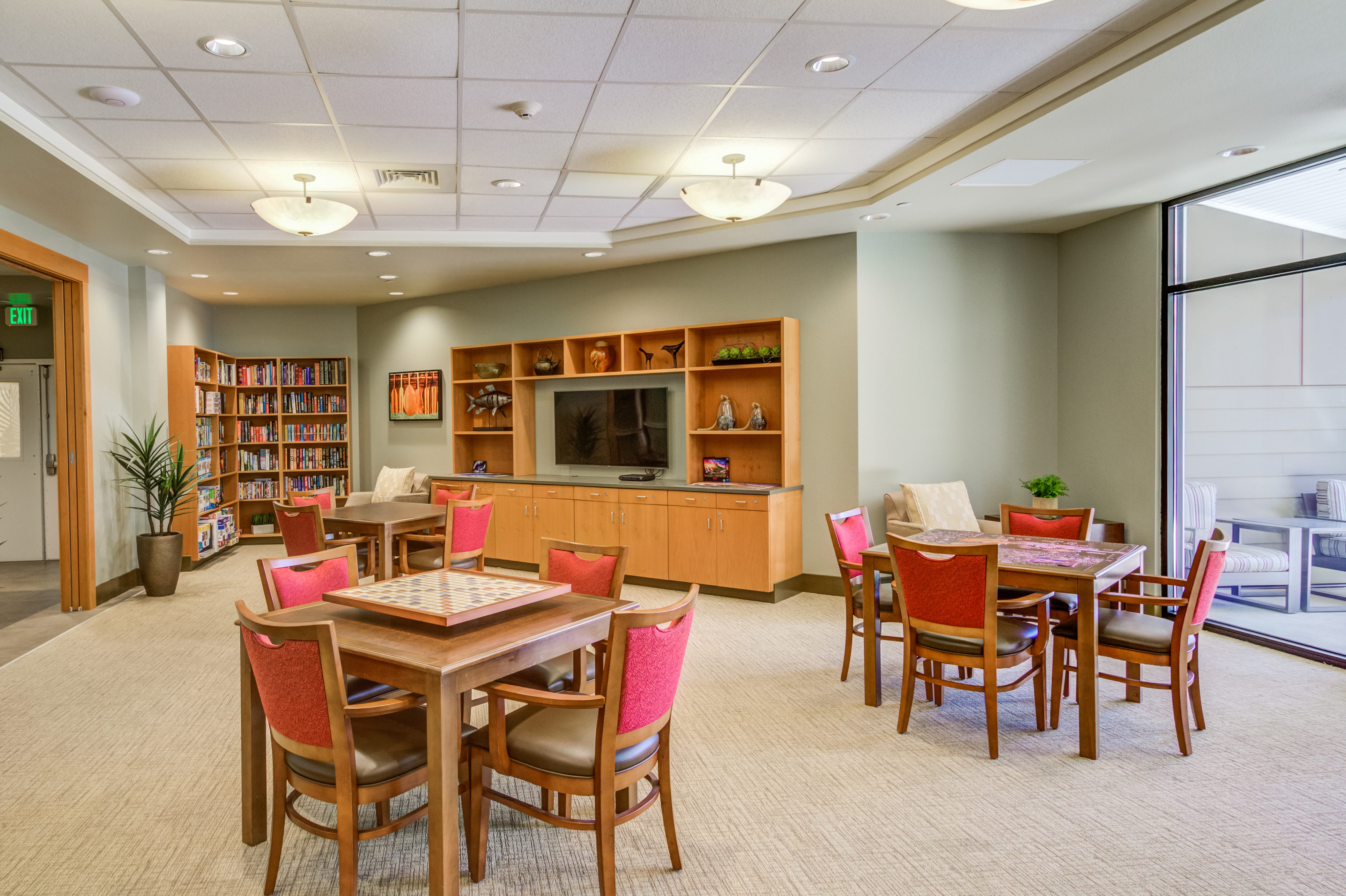 Resident library and game room at The Plaza Assisted Living Kaneohe.