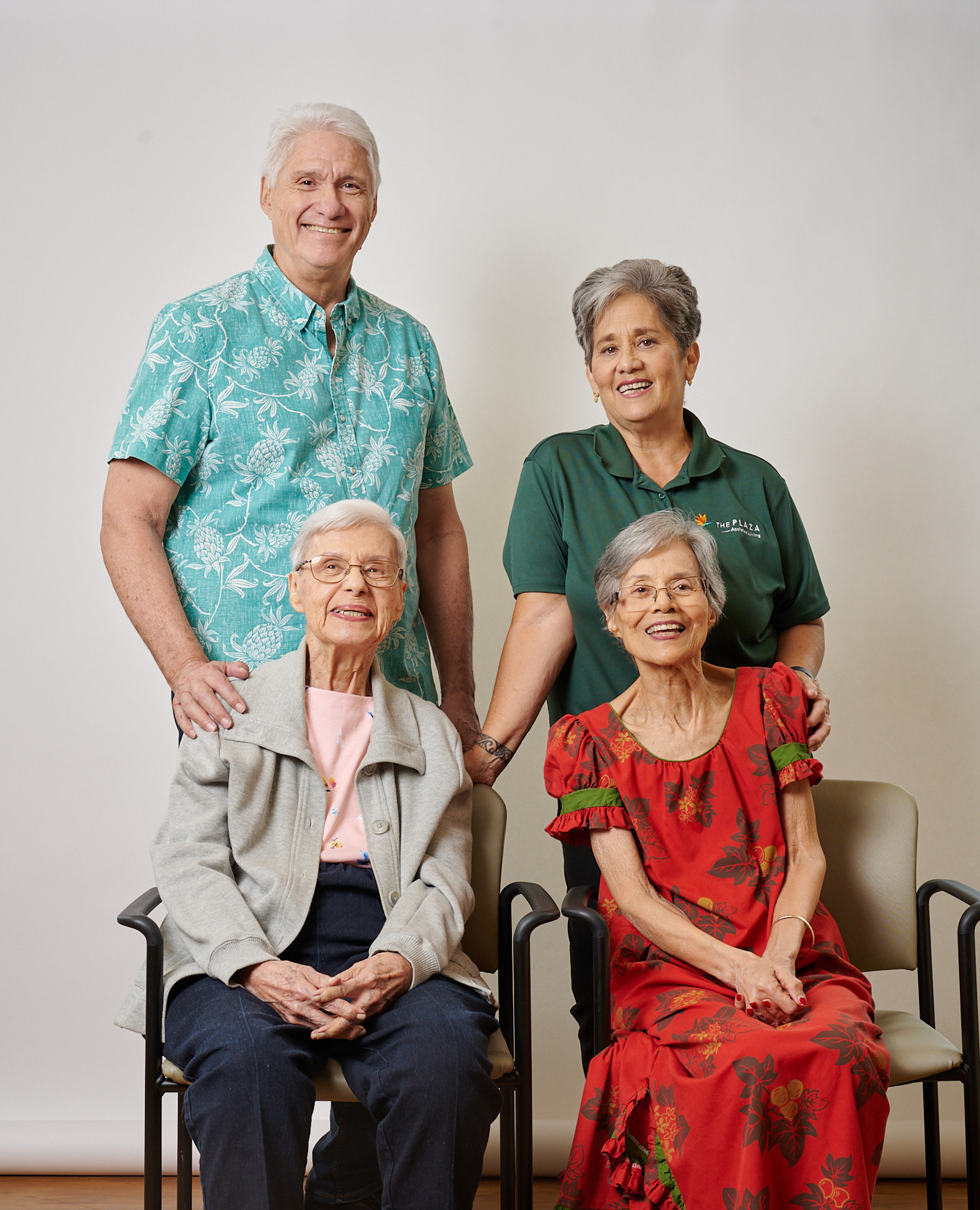 Residents and staff posing together at The Plaza Assisted Living.